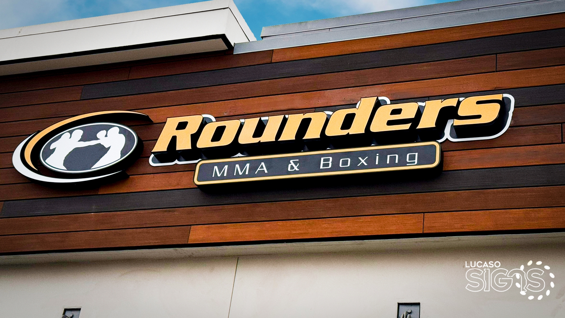 Custom channel letter sign for Rounders MMA and Boxing with logo on wood facade by Lucaso Signs