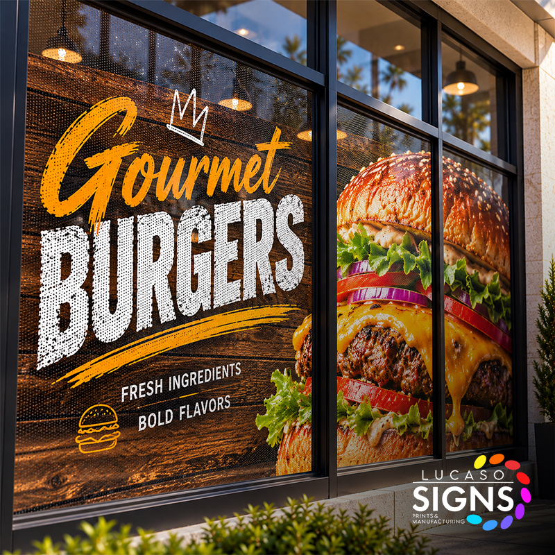 Custom restaurant window graphics featuring full-color burger advertising printed on perforated see-through window vinyl.