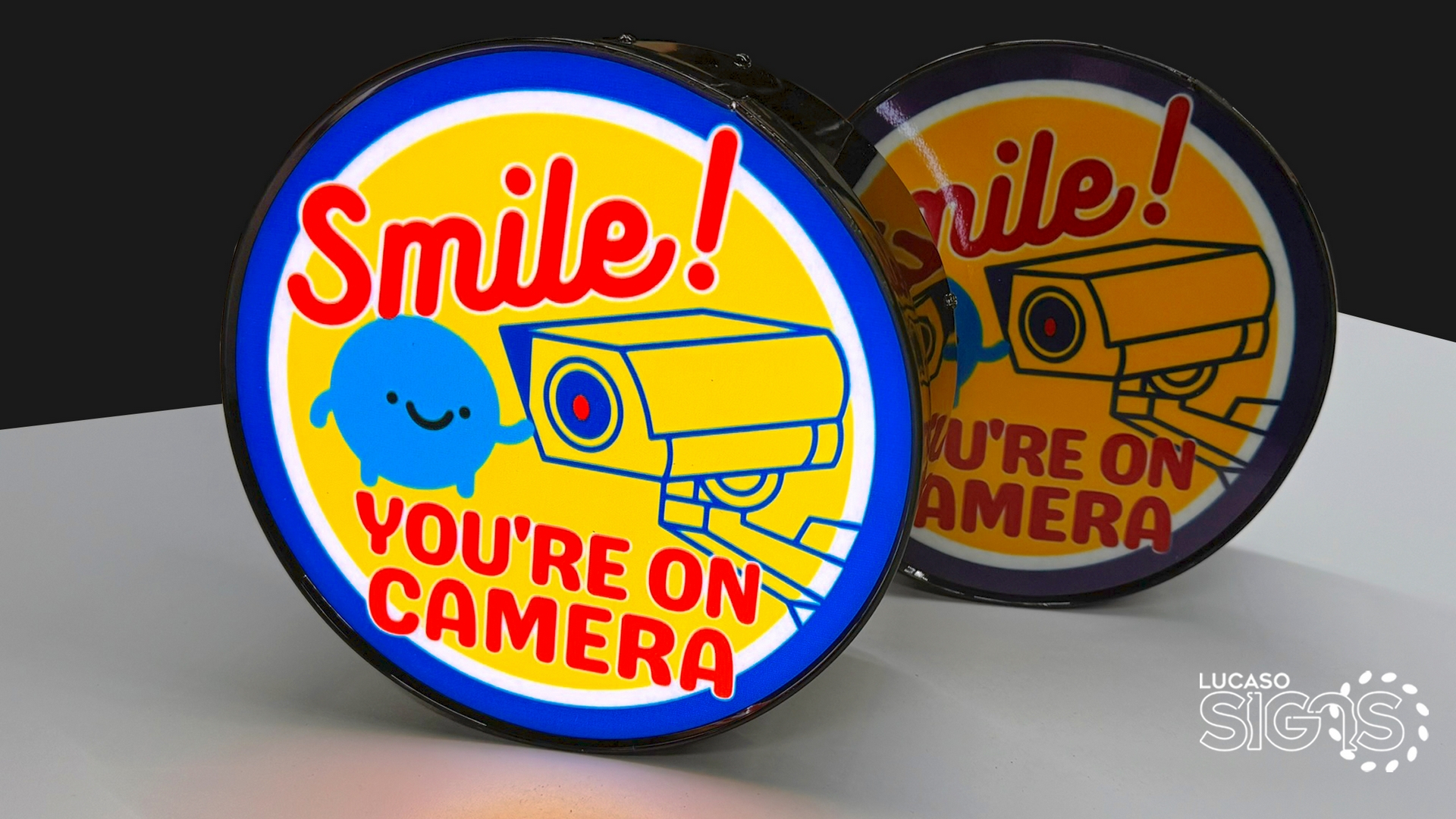 Rounded logo illuminated by lucaso signs