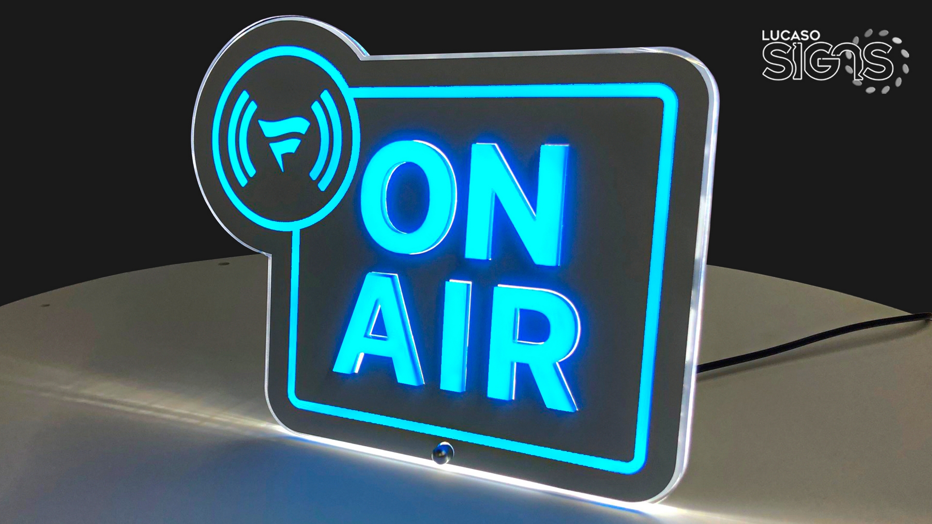 Custom ultra-thin LED light box sign with blue ON AIR text by Lucaso Signs