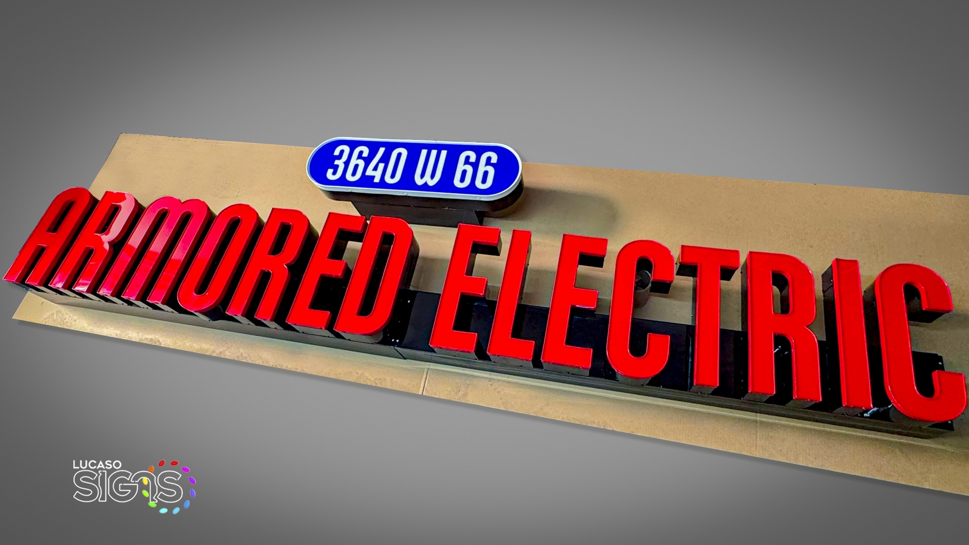 Armored Electric custom red channel letters sign on raceways