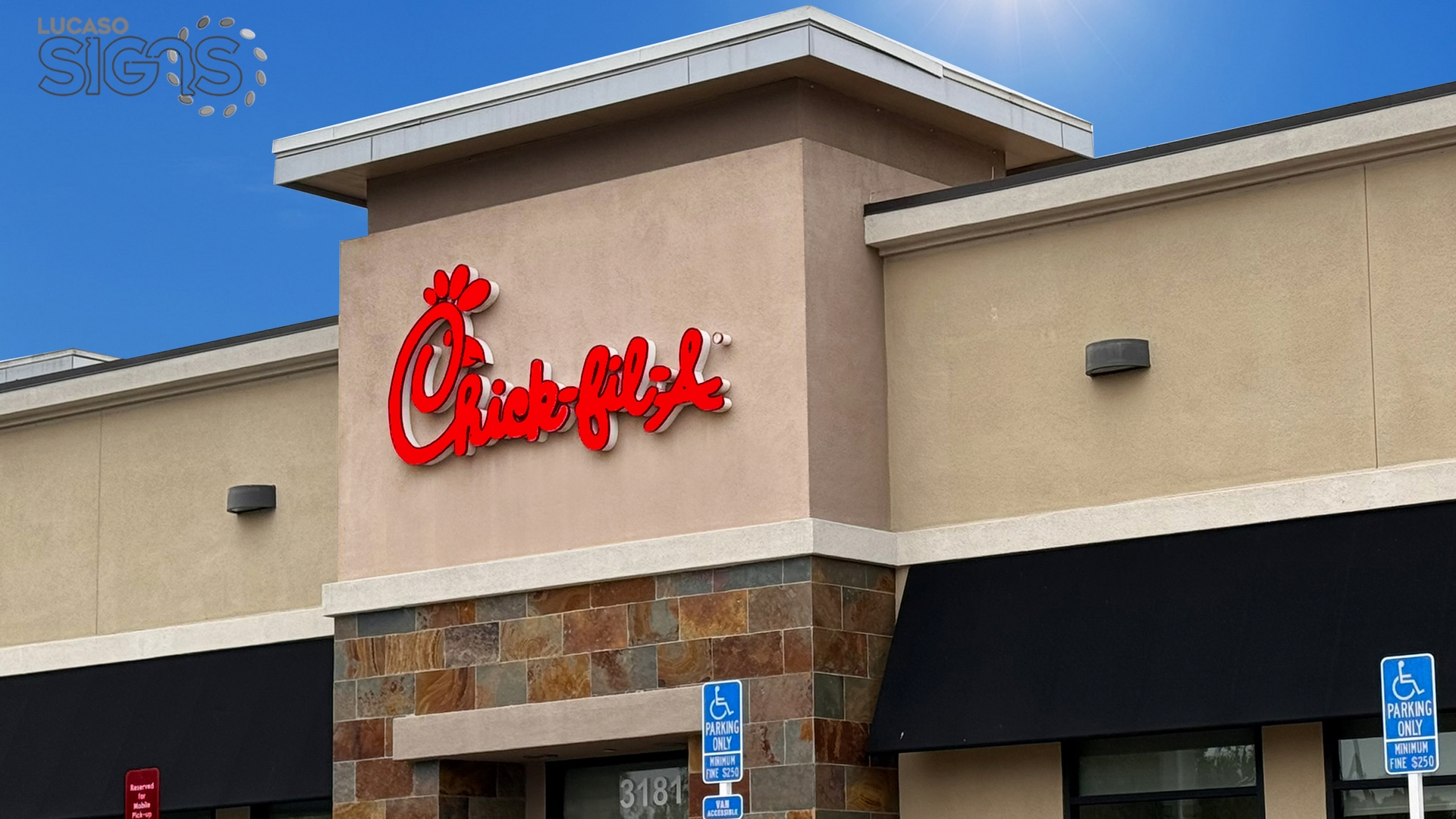 Red illuminated channel letter sign for Chick-fil-A storefront by Lucaso Signs